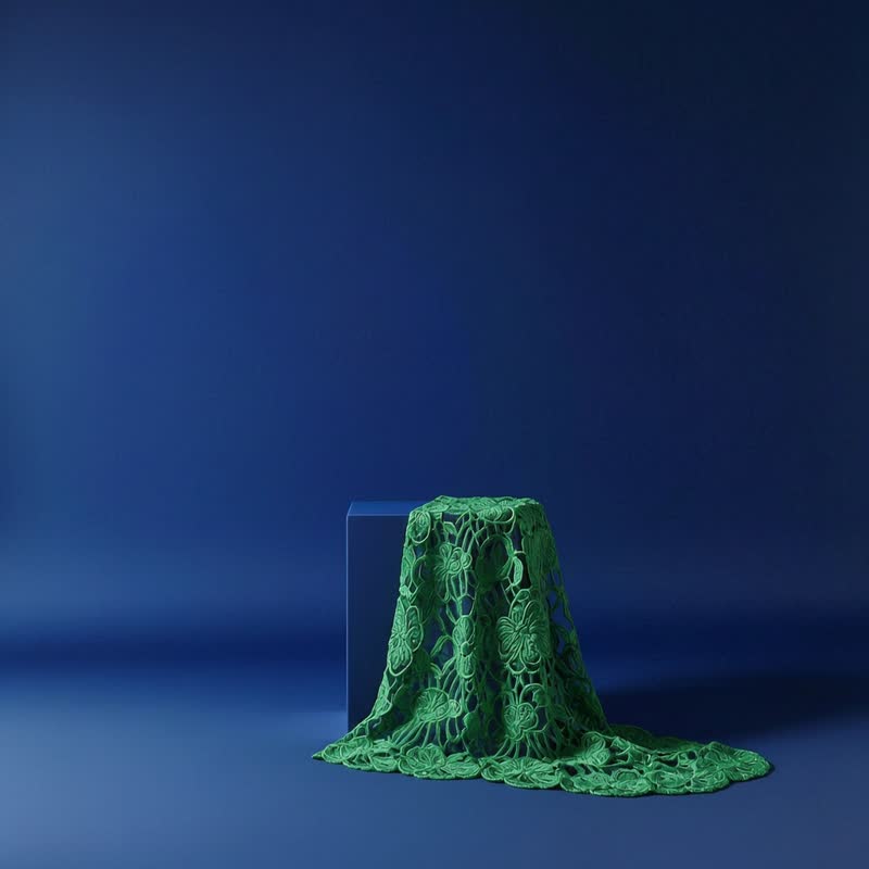 Guipure lace draped over the reference plinth