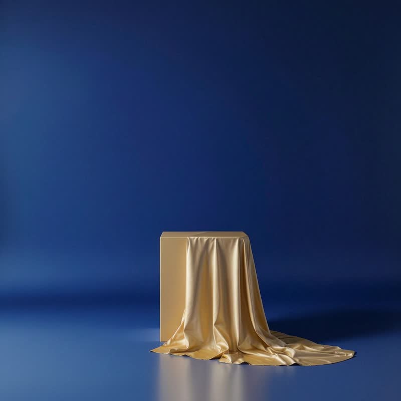 Satin draped over the reference plinth